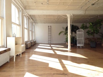 Natural daylight soho loft with light hard wood floors, while walls