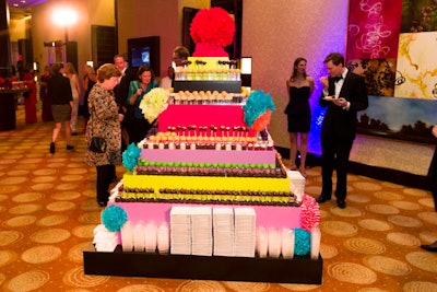 Dessert buffets don't have to be simple tables: for the Boston Children's Museum's 10th anniversary gala in October last year, the catering team at the Intercontinental Boston used a giant prop cake to display and serve sweet treats, including cake pops, mini whoopie pies, mini Twinkies, and chocolate-dipped strawberries. The oversize piece was a champagne tower from the New England Country Rentals warehouse, and staffers from Rafanelli Events dressed it with festive paper flowers.