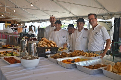 The Hampton Classic Horse Show is always a bittersweet end to summer. You look forward to it, but it means that it is all over. Sigh. I dropped by the kitchen to say hello to the chef team from Robbins Wolfe (pictured, with proprietor Chris Robbins). They had just served dinner the night before at the Parrish Art Museum event for Samuel Waxman, and they were just beginning an eight-day run as the house catering team at the event, where the humble kitchen will serve 8,000 meals and 1,200 drinks over the course of the event.