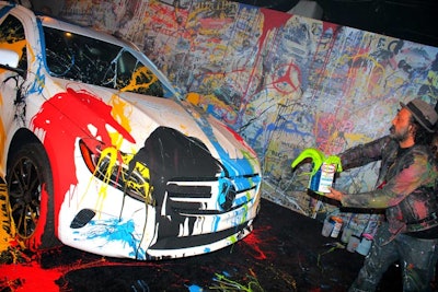 Mr. Brainwash—Los Angeles-based street artist Thierry Guetta—created a freestyle design on the exterior of a brand-new GLA, which was painted matte white and sat parked at the entrance to the concert space.