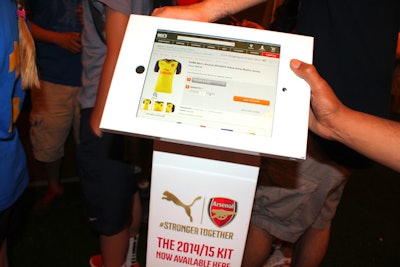 Digital tablets let guests check out Puma's Arsenal Football Club Kit, which includes items such as jerseys, shorts, and socks.