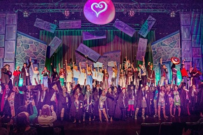 At the end of the opening ceremonies, a makeshift gospel choir sang a parody rendition of “Love Is an Open Door” from Frozen. The 40 choir members were LeakyCon attendees who had responded to a request on Twitter for “choir geeks” to bring their robes and attend a rehearsal.