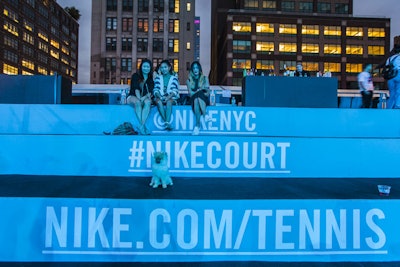 The build out included amphitheater-style seating for spectators. As a clever way to encourage pop-up visitors to interact with its social channels, organizers branded the seats with handles, hashtags, and website URLs.