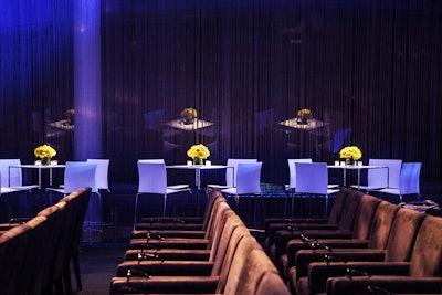 Flanking both sides of the screening space were 27 modern square chrome-and-white highboys, 108 contemporary stools, and four half-moon banquettes with coffee tables and ottomans for guests to engage in conversation, relax, and have a bite of food.