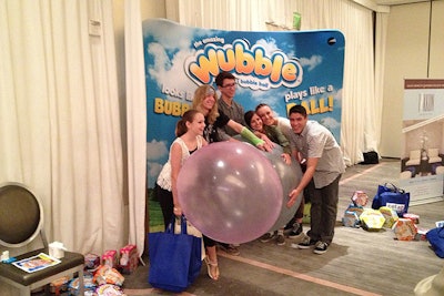 Interactive stations at the Teen Choice Celebrity Gifting Suite gave guests the opportunity to play with products like the Wubble Bubble Ball or pose for photos at PETA2's table.