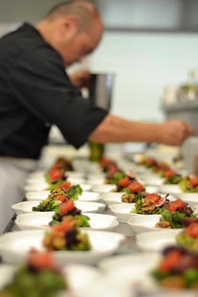 Preparing grilled gem salad for 1st course