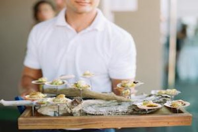 Scallop shells are magnetically affixed for guests to easily remove and return, after savoring the hors d’oeuvre.
