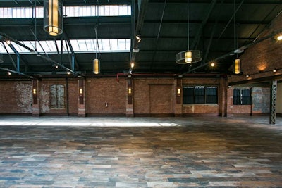 Exposed brick and beams add a rustic element to any corporate event