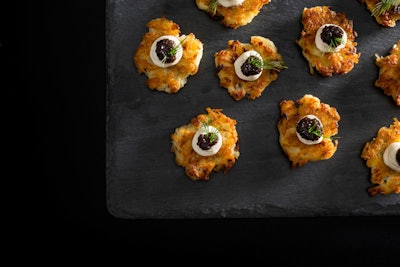 Golden potato pancakes with creme fraiche and caviar