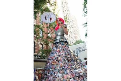 Brand Ambassadors walking along the NYC Gay parade route took hundreds of polaroid selfies that were affixed to the gown of a 10’ tall drag queen #expressyourselfie