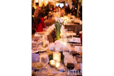 Candles, mercury glass, and wintery florals make each table feel intimate and festive!