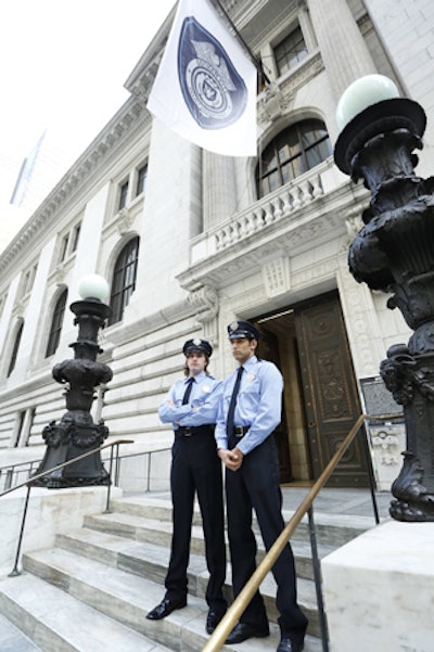 Actors dressed as members of the Gotham City Police Department stood guard at the entrance. To add to the atmosphere, inside, detectives frisked and handcuffed suspects in the halls outside the screening room.