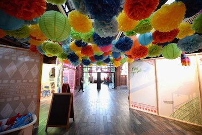 At the New York event, colorful paper lanterns and Mexican-style paper flowers strung from the ceilings lent the event a fresh, youthful feel.