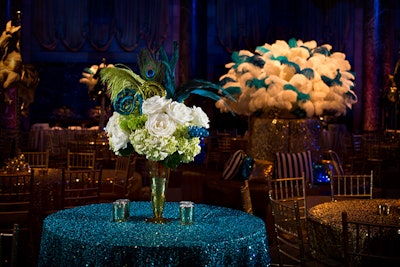 The decor was decadent, sparkling in turquoise and gold accented with graphic patterns of black and white stripes