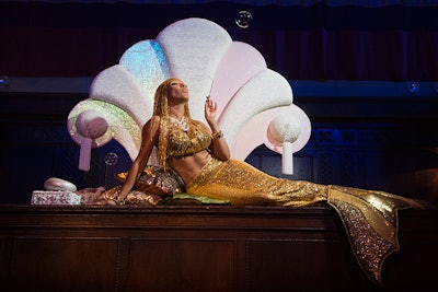 Gorgeous golden mermaids were perched on the main bar. They blew bubbles and interacted with guests throughout the evening, offering sweet delights from a jewel and shell encrusted box.