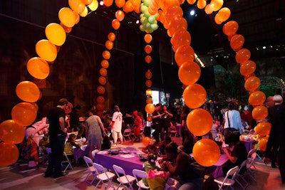 At Keep a Child Alive’s “Dream Halloween” event at the Barker Hangar in Los Angeles last October, a display of oversize orange and green balloons mimicked the look of a giant pumpkin for a kid-friendly take on decor.
