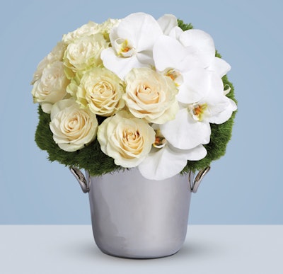 Luxury silversmith Christofle collaborated with Kalla to create a gift featuring fall blooms housed in Christofle's Vertigo champagne bucket. Instead of a vase for a floral base, the silver ice bucket adds a polished finish to the limited-edition bouquet.