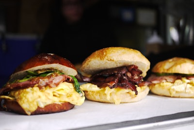 In Chicago, the Eastman Egg Company provides catering for meetings and events. The company focuses on gourmet breakfast sandwiches such as “the Scoundrel,” which is served on a pretzel roll with egg, smoked turkey, white cheddar, wilted spinach, and spiced honey mustard. Packages include breakfast sandwiches with hot and iced coffee, orange juice, and sides; a food truck is also available for private events.