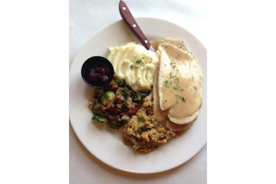Roasted Vermont sliced turkey breast, stuffing, creamy mashed potatoes, vegetables, and cranberry sauce