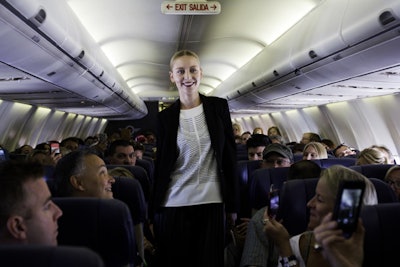 As models walked down the aisle, passengers could post to social media using the in-flight WiFi.