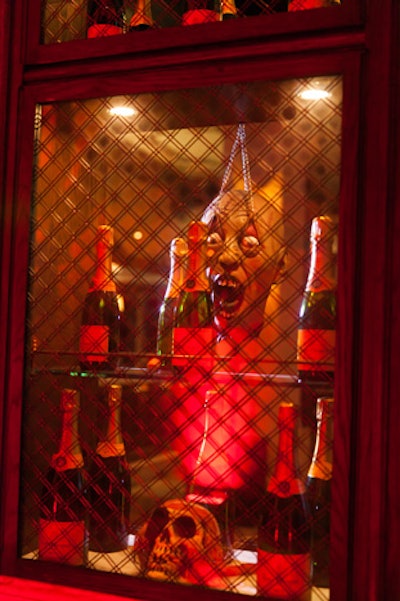Spook guests by placing prop skulls or scary masks in unexpected places. At the Hollywood Roosevelt Hotel in Los Angeles in October 2013, Veuve Clicquot passed flutes of Yellow Label at its Yelloween party, which featured a liquor cabinet decked with startling tropes.