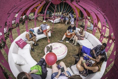 In the T-Mobile Sonic Garden, guests lounged inside pink and white structures meant to resemble seed pods. The lounges included comfortable seating and phone-charging stations.