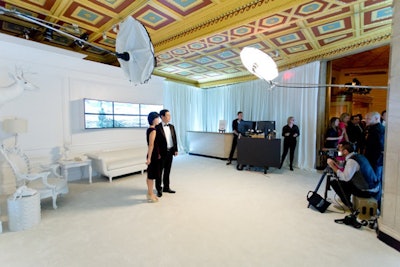 In a separate room from the gala, guests could pose for portraits photographed by Roberto Chamorro. The space was decked out in all-white furnishings, carpet, and decor, with the only color provided by six LG TV screens that displayed classic works of art. Photos were sent to guests after the event.