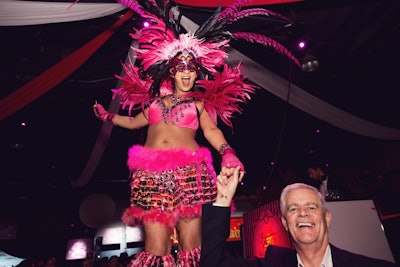 During the event, pink-suited stilted dancers made their way through the crowd for a whimsical effect.