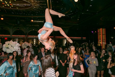 Event photography of an acrobat from US Weekly's Fashion Week party in Times Square, New York