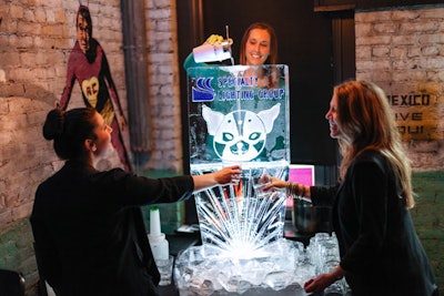 A custom logo ice luge takes traditional cocktail service to the next level