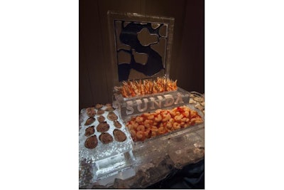 A seafood raw bar with customized ice trays and logo sculpture