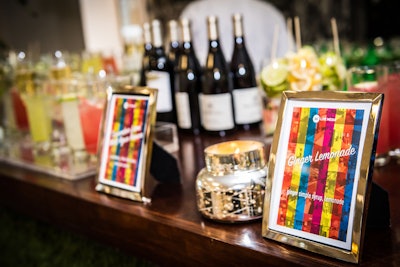 Framed colorful signs marked each station for guests, including the bar and its selection of signature cocktails.