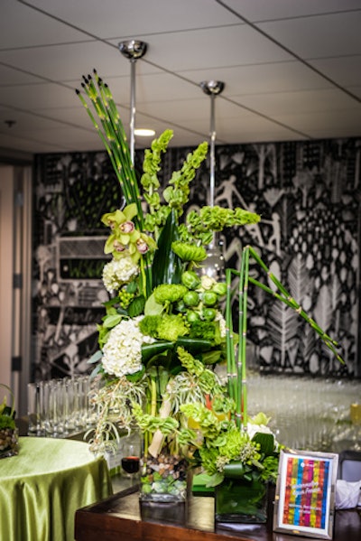Green and white arrangements from Flowers on Fourteenth included stalks of Brussels sprouts.