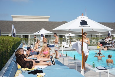 Branded beach umbrellas were erected around the pool, and guests received branded totes with beach essentials like towels, sunglasses, and reading material.