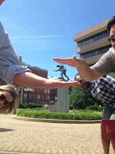 Colleagues find a fun way to shoot a forced perspective photo