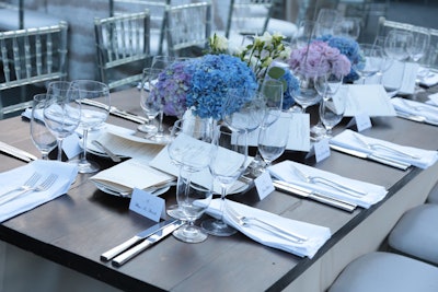 The American Ballet Theatre held its annual gala in Los Angeles at the Jeanne and Anthony Pritzker estate in Beverly Hills. With the home’s architecture and sweeping views as a backdrop, about 250 guests dined at wooden-topped tables with white linens and blue and lavender floral arrangements.