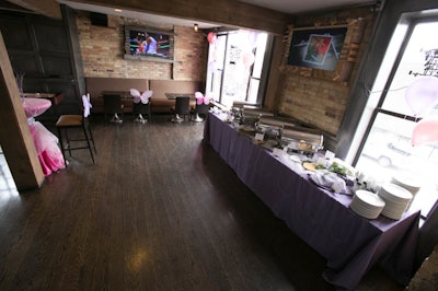 A buffet set up along the wall gives guests a view of Wrigley while they eat