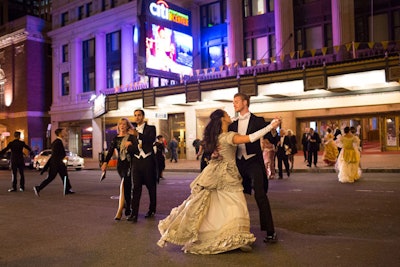Inspired by the evening's production of La Traviata, dancers from Touch Performance Art dressed as French courtesans and danced in the streets as guests moved from the dinner to the performance.