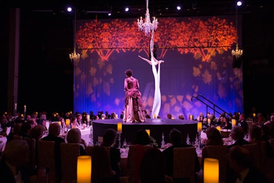 During dinner, entertainers performed on a small, round stage set atop the larger stage. The performance included operatic songs and an act from aerialist Rachel Lancaster.