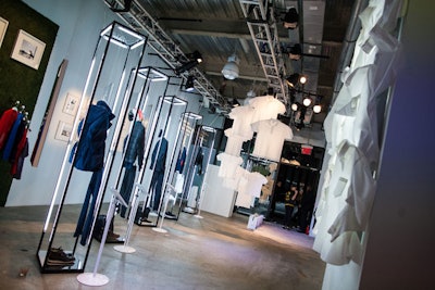 Upon entering the 2,400-square-foot ground floor, guests were greeted by a sweeping polo display in a retail environment meant to be equal parts gallery experience and online point of sale. Directly underneath were vitrines featuring five full looks from the Lacoste City Golf, Mountain Golf, and Sport collections suspended in custom designed and fabricated frames, complete with mirrored bottoms and lit from above and the sides. Guests interested in the garments on display could purchase them directly—or find a nearby boutique—via a series of adjacent iPads.