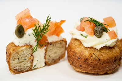 Savory mini lemon dill croissant-doughnuts filled with horseradish crème fraîche, smoked salmon, fried capers, and chives, by Abigail Kirsch in New York