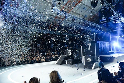 At the conclusion of the fashion show, confetti canons blasted metallic tinsel onto the runway, marking the end of one phase of the night and the start of the next.