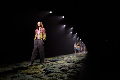The Dries Van Noten show, held on September 24 at the Grand Palais, featured a runway-cum-carpet hand-tufted by the Buenos Aires-based artist Alexandra Kehayoglou. With a collection inspired by the magical woodland in John Everett Millais's painting 'Ophelia,' dusky golden lighting complemented the mossy forest floor that will be reused for events around the world.