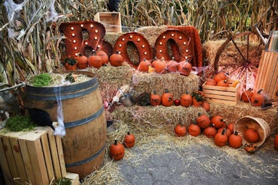 The producers sourced marquee-style signage, hay bales, dozens of pumpkins, and vintage throw blankets to create an immersive, fall-focused environment for the promotion.