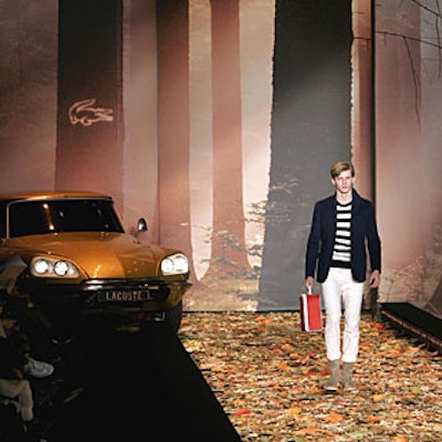 Lacoste debuted its fall collection in 2007 with a New York runway show inspired by French films of the 1970s. The concept inspired a printed backdrop and silk leaves covering the runway.