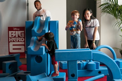 Children experimented with building blocks and puzzles at the Disney “Creativity Area.”
