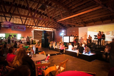 At the family-friendly event, young guests sat directly in front of the stage on illuminated platforms.