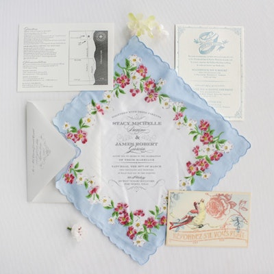 Lucky Luxe offers a selection of pretty handkerchief designs, which can be customized with various ink colors. Pricing is from $721 for 25 invites with return-address envelopes.