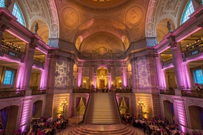 The Symphony Supper was served in the rotunda of City Hall. McCall's was the caterer for the evening, and menu items included a 'mosaic' of Maine lobster, avocado Marquise, asparagus, watercress, shaved beets, and quail eggs; smoked sea-salt filet of beef; and baked Alaska.