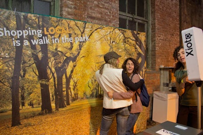 As part of New York's Wine & Food Festival in 2012, Whole Foods's activation included a photo op with a backdrop that looked like a scenic tree-lined pathway in a fall foliage wonderland.